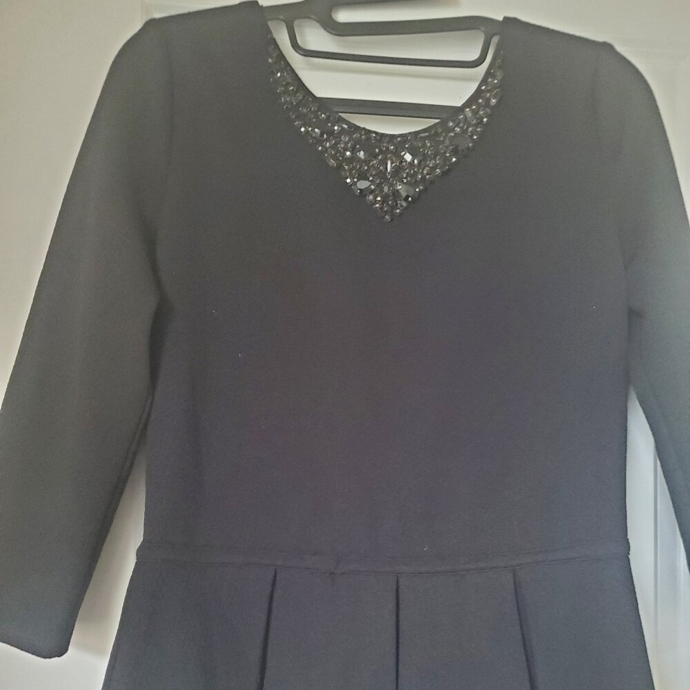 Black top with stones